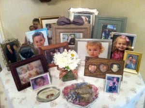 Elderly persons end table with photos