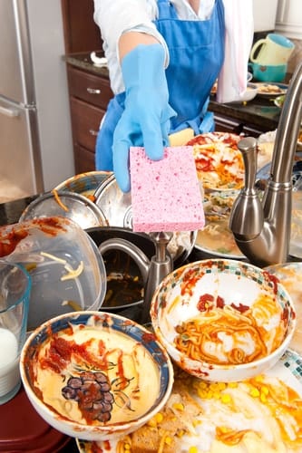 Housekeeper with dirty dishes