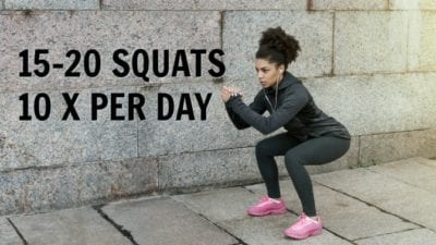 Woman doing squats as warm up exercise