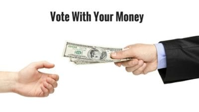 hand of money giving tip, vote with your money