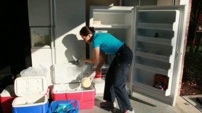 How to Defrost a Freezer by unpacking food, put in coolers