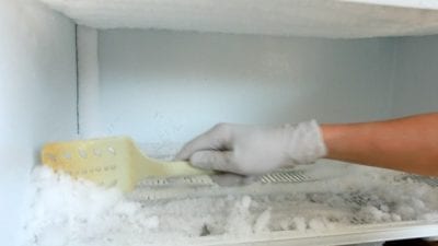 How to Defrost a Freezer using a rubber spatula