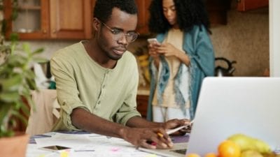 Family Support man paying family bills