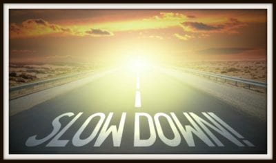 being a leader vs. being in charge Slow Down signs on road