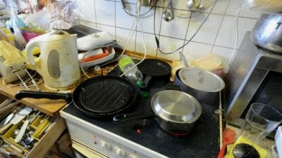 Not enough food in kitchen of animal hoarders