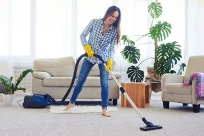 Growth Disclosure Woman Vacuuming Floor
