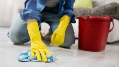 Learn to Clean scrubbing floor on hands and knees