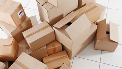 Organizing boxes on tile floor