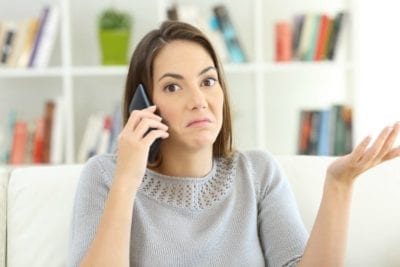 Woman on phone giving a bad customer survey