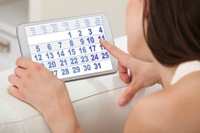 Bidding Variables Woman on electronic calendar