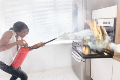 Survival Tool for House Cleaners, Woman Putting Out Fire in Oven-min