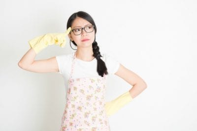 Survival Tool for House Cleaners, Woman in Apron and Gloves Thinking-min