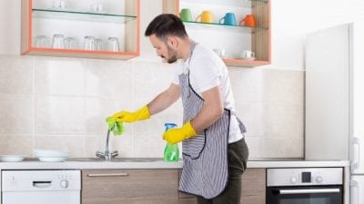 Social Media Presence Male House Cleaner at Kitchen Sink
