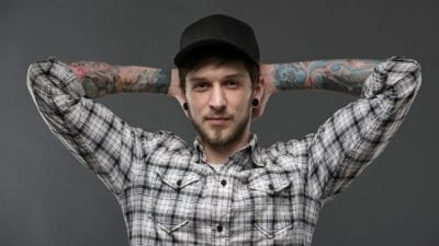 Social Media Presence Well Groomed Man with Tattoos