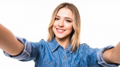 Social Media Presence young woman takes selfie for personal profile
