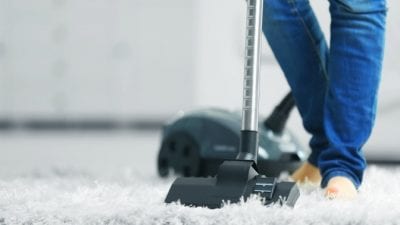 Speed Cleaning Vacuum Style Man vacuums carpet