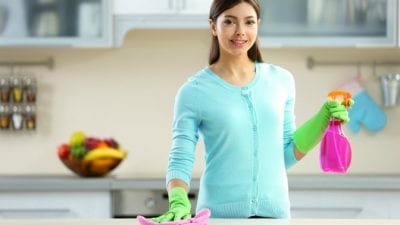 Auditions for House Cleaning young woman house cleaner in kitchen