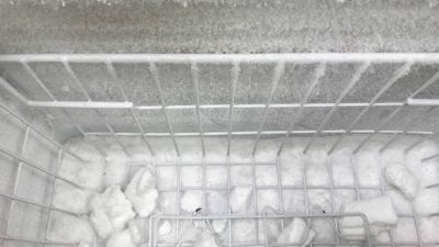 Suspend House Cleaning Service freezer covered in frost