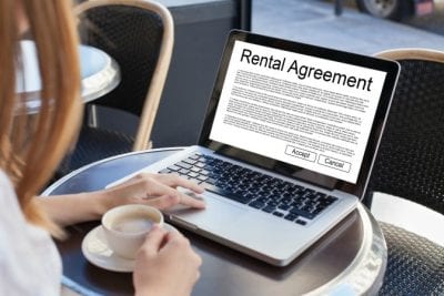 Airbnb Guests Clean Up, Computer With Rental Agreement