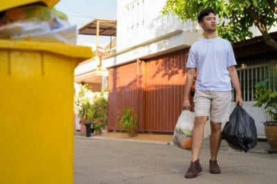 Airbnb Guests Clean Up, Man Taking Out Trash