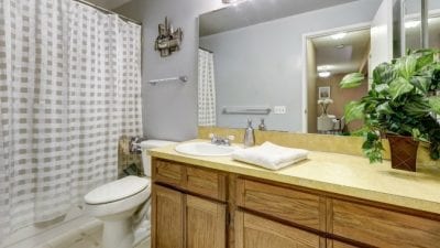 How Much to Clean 5 Rooms bathroom with shower tub and mirror
