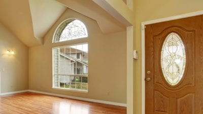 How Much to Clean 5 Rooms living room with arch window and hardwood floors