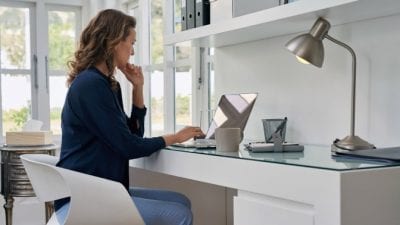 How Much to Clean 5 Rooms woman working at home office