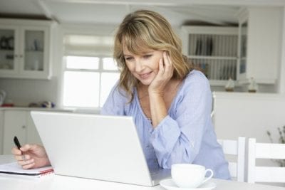 Advertise a Cleaning Business with No Money, Working Woman on Computer
