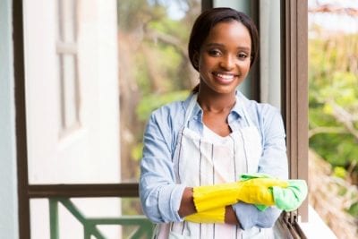 Do You Need a Housekeeper, Smiling House Cleaner With Arms Crossed