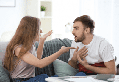 In Business With Your Spouse, Man and Woman Arguing on Couch