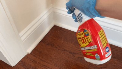 How to Clean Baseboards, Krud Kutter with gloved hand