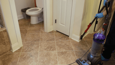 How to Clean Baseboards, vacuuming baseboards with vacuum attachment