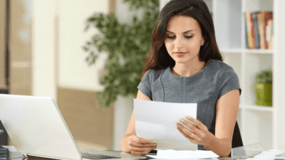 Best Advice woman looking at paper