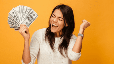 How Workers Compensation Works excited young woman holding money