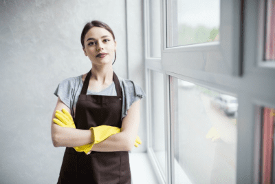 Tips for Buying a Cleaning Business, House Cleaner Arms Crossed