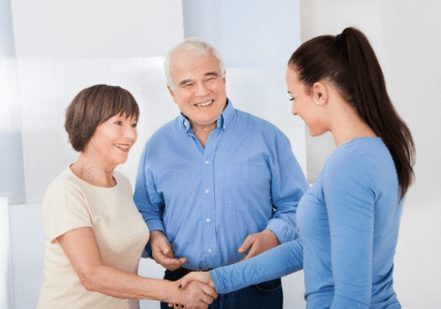 Tips for Buying a Cleaning Business, Older Couple Meeting Young Woman