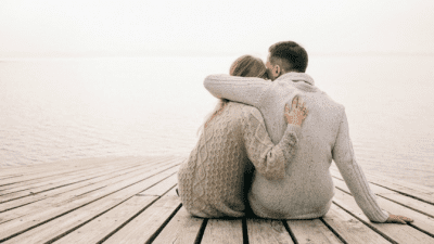 Tips for New Moms spouses hugging on dock, isolated