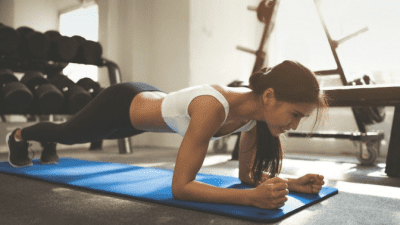 Tips for New Moms young woman exercising at gym