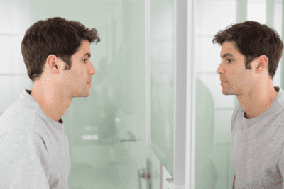 Too Depressed to Clean, Man Looking at Himself in Mirror