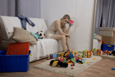 Rates for Hoarding Cleanup Woman Sorts through toys