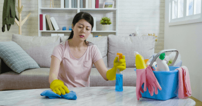 How to Get Your Cleaning Mojo Back, Serious Woman Cleaning