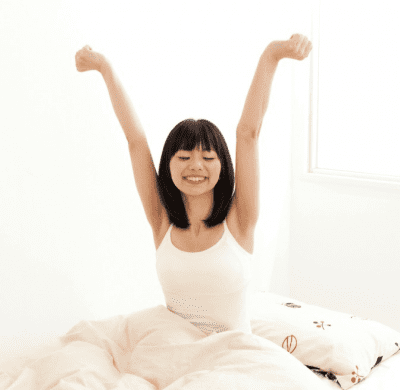 Is Niceness Killing Your Cleaning Business, Woman Stretching in Bed
