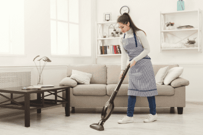 What Kind of Vacuums Should We Use, Woman Vacuuming Living Room