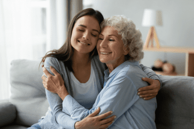 Client is Moving - How Do I Raise My Prices, Woman Hugging Senior Woman
