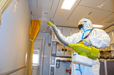 Disinfect as a Professional House Cleaner, Man in Hazmat Suit Cleaning with Fogger