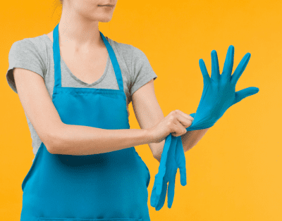 Spend Annually on Cleaning Supplies, House Cleaner Putting Gloves On