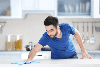 Where Do You Start in Your Cleaning Business, Man Cleaning Counter