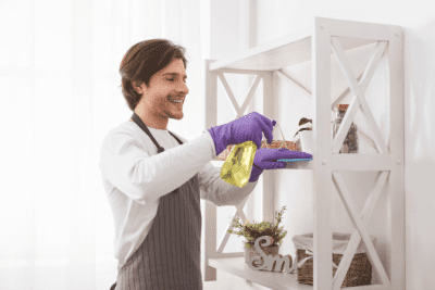 What I Learned from Cleaning Houses for Celebrities, Man Cleaning Shelves