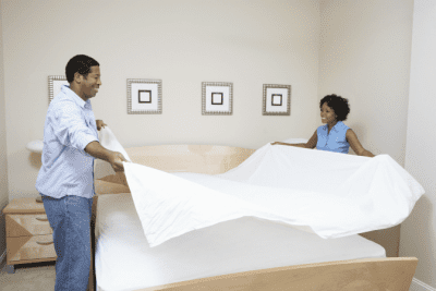 What I Learned from Cleaning Houses for Celebrities, Man and Woman Making Bed