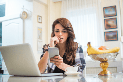 Business or Job, Woman Looking at Cell Phone and Biting Nail